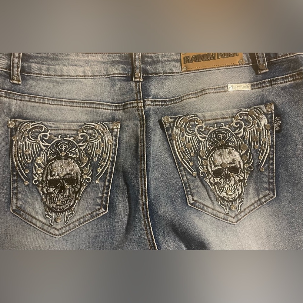 Platinum Plush rhinestone skull blue jeans